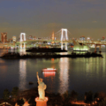 Odaiba Statue of Liberty in the Tokyo Bay, with the Tokyo rainbow bridge behind