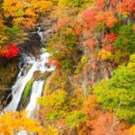 Kirifuri Falls in Tochigi prefecture, surrounded by colourful autumn foliage.