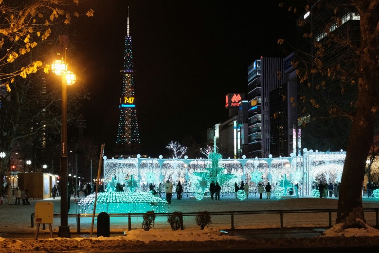 The Sapporo Snow Festival illuminated at night. Where to stay in Sapporo for the Sapporo Snow Festival