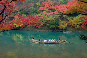 Passengers on the Hozugawa River Boat Ride during Autumn.