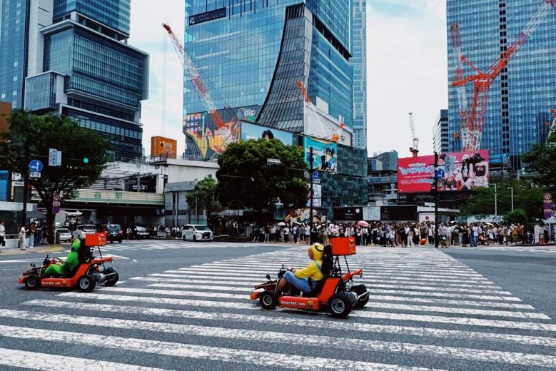 A man on a Tokyo Go-Kart Tour, in the heart of Shibuya
